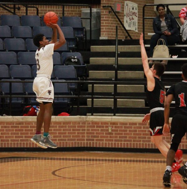In the beginning of the season, Junior Desmond Clark choose to be number 3 for our Varsity Boys Basketball team.
