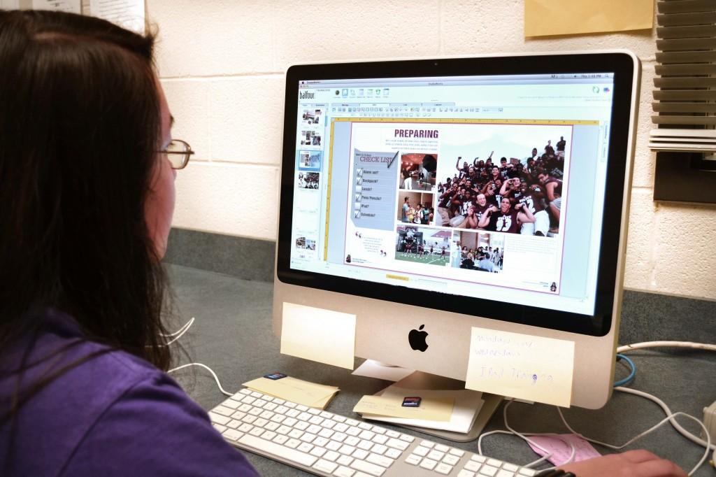 Photo Editor, Lynna Nguyen, works on the school yearbook.