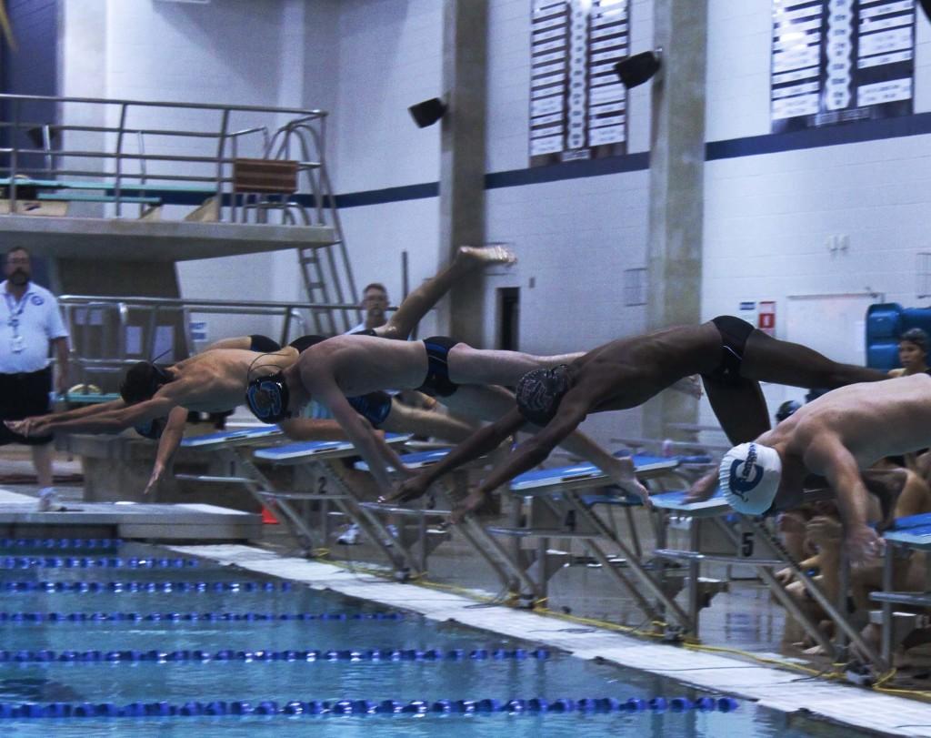 Junior, Marc Johnson, helped the Guys Swim Team placed third, on January 24, at the District meet. 