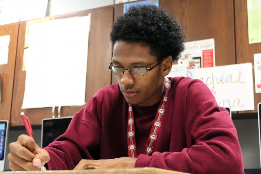Junior Undre Jordan, fills out his dedication contract for an AP course. 