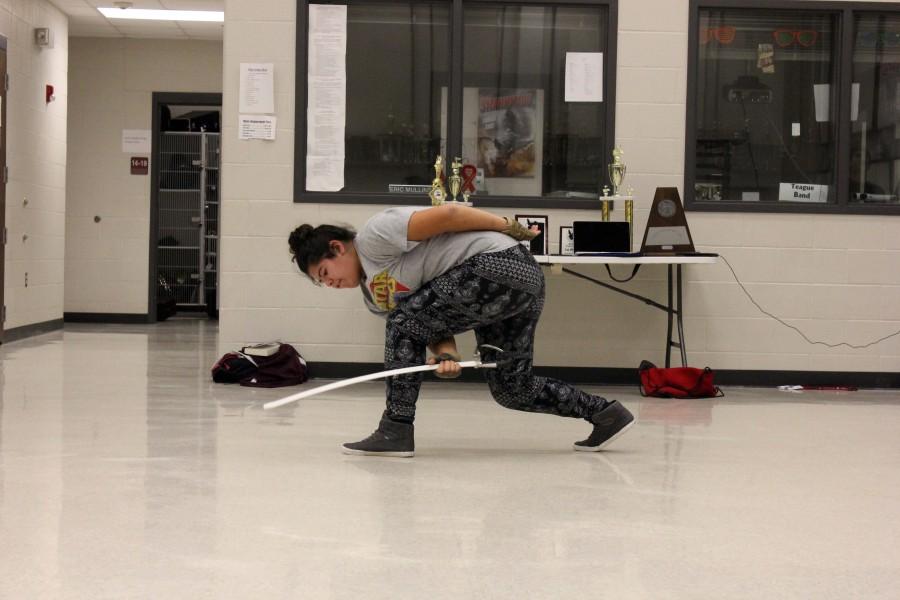 During Color Guard class, Natalia Lizcano practices for the upcoming competition. 