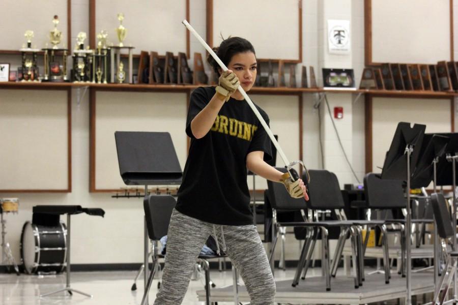 Preparing for their last Winter Guard competition of the season, Adriana Tapia practices her savor work.  Last competition Winter  Guard received 3rd place out of 11 competing teams. I placed at championship my first year, so i just want to do the same my last year, Tapia said. 