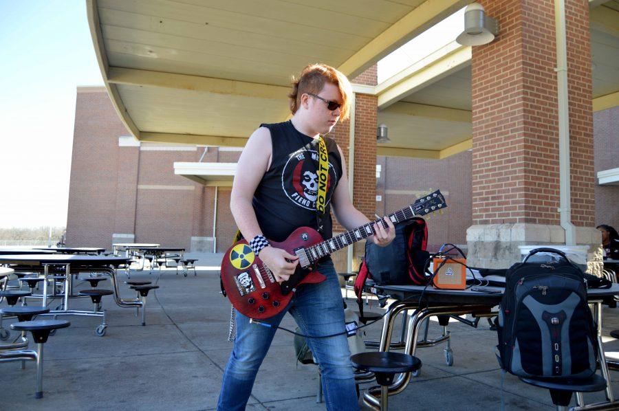 Freshman Shares Guitar Skills During, After School