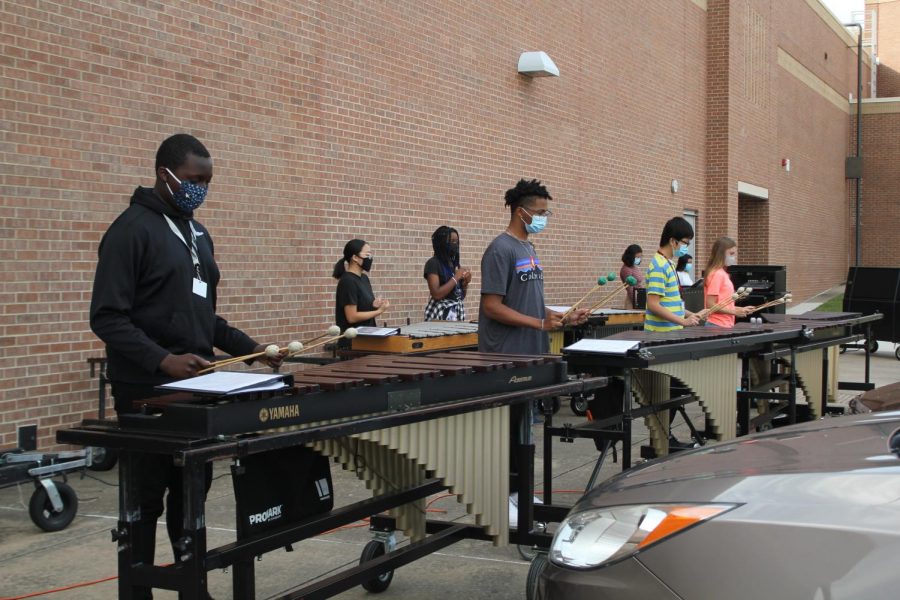 The band practices during sixth block outside, near the band hall.